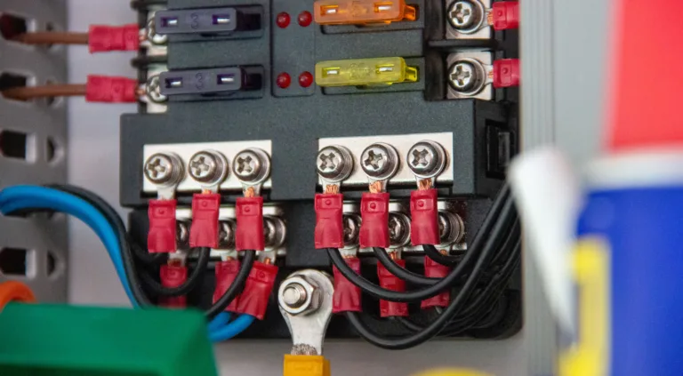 DC fuse box with blade fuses and crimped red and black cables