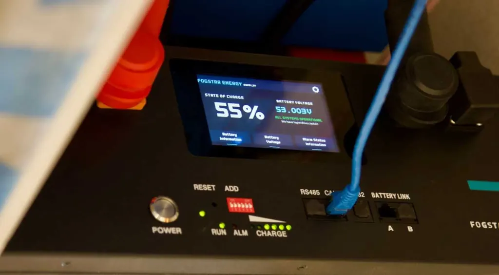 Fogstar 48 volt lithium battery screen showing state of charge in an off-grid cabin
