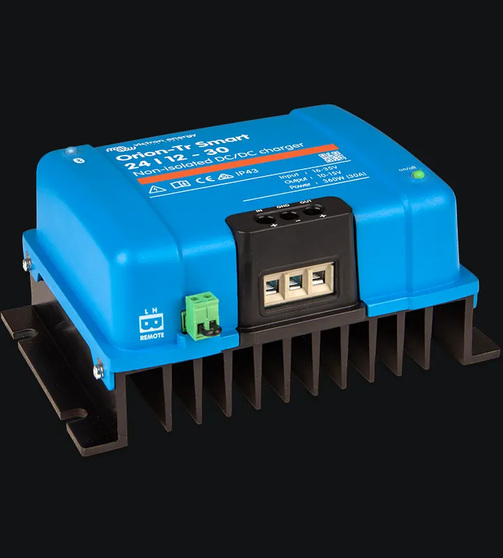 Victron Orion-Tr Smart 24/12-30 non-isolated DC-DC charger in Victron blue, showing the IN, GND and OUT power terminals and the green two-pole remote connector marked L and H on the side